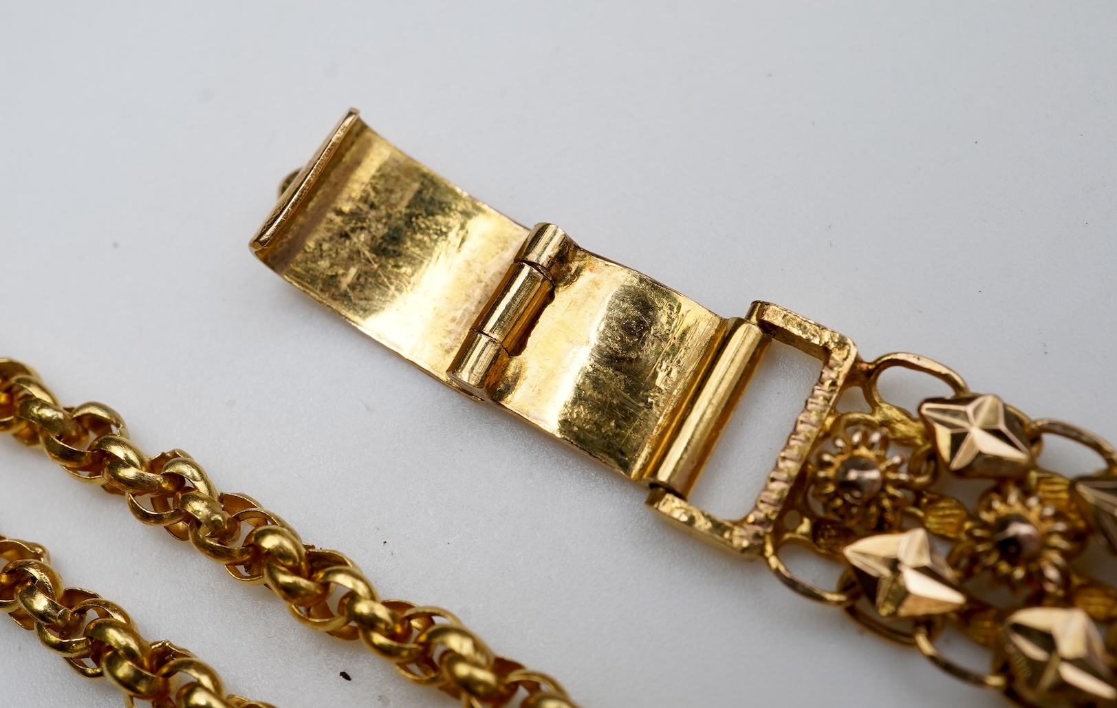 A Chinese pendant necklace and two gold bracelets